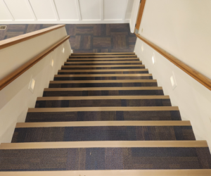 Newly installed carpet tile on stairs, showcasing a professional carpet contractor job by Flooring of Springfield in Springfield, IL.