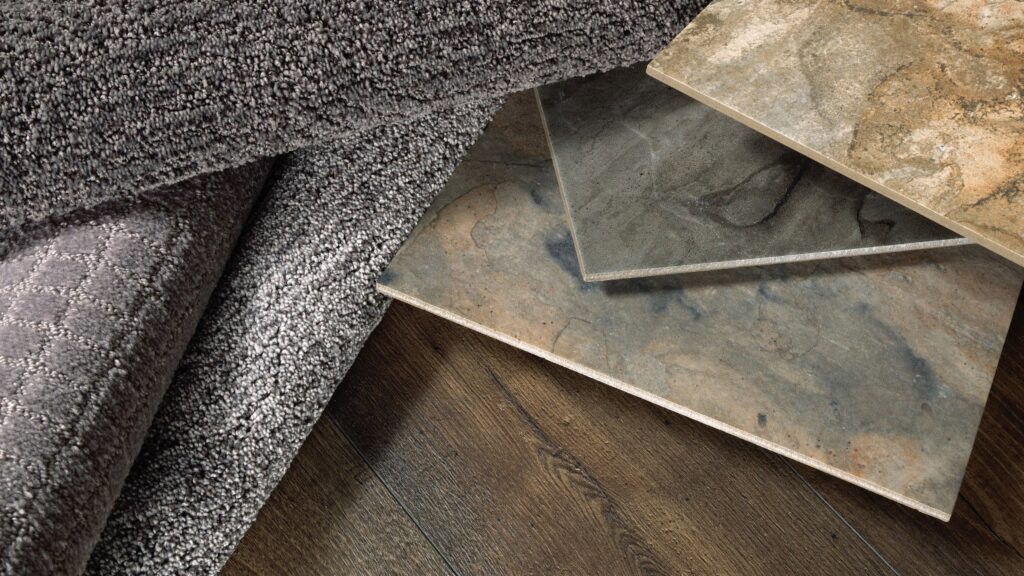A display of carpet, tile, and wood flooring samples for selection at Junge's Flooring in Rochester, MN