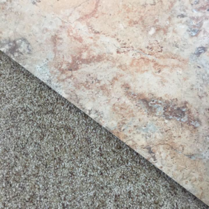 A close-up view of a seamless carpet to tile transition installed by Advanced Flooring Consultants in Lititz, PA.