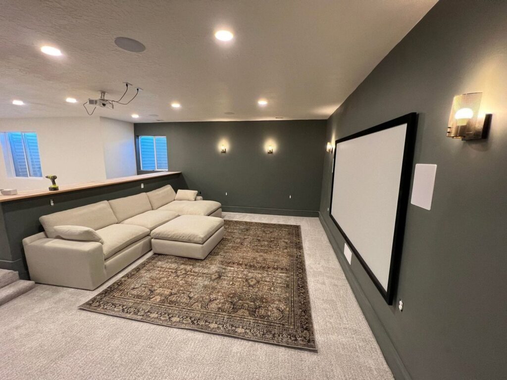 Wide view of a carpeted home theater room, a project by All about flooring utah in Salt Lake City, UT.
