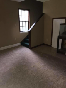 A clean, well-maintained carpeted room and staircase by Commercial Floor Maintenance in Biloxi, MS.