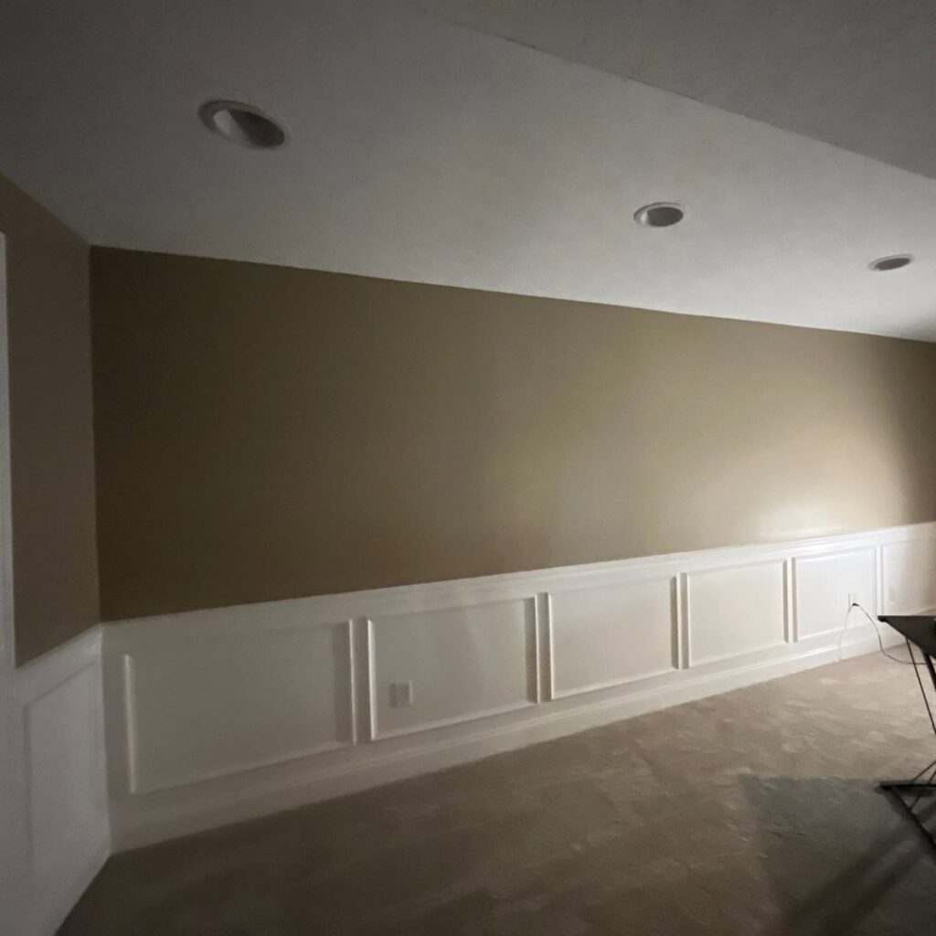 A beautifully carpeted room with wainscoting, showcasing quality work by Ohio Pro Group in Columbus, OH.