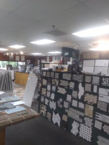 A view of the carpeted showroom floor at Palmetto Tile Columbia in Columbia, SC, showcasing various flooring options.
