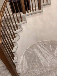 Overhead view of a beautifully carpeted staircase and landing by All about flooring utah in Salt Lake City, UT.