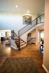 A beautifully carpeted staircase and a large area rug in a home, showcasing quality flooring by Kearney Flooring in Kearney, NE.