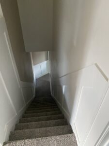 A newly carpeted staircase, a completed installation by Carpet Warehouse in Lafayette, IN.