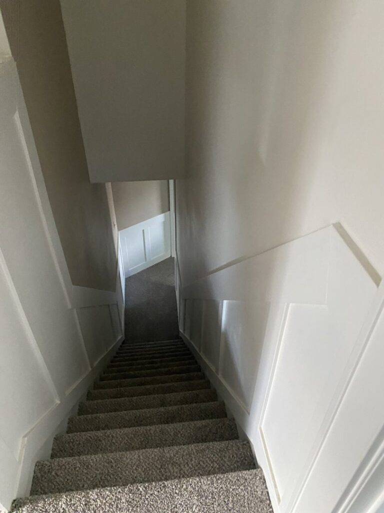 A newly carpeted staircase, a completed installation by Carpet Warehouse in Lafayette, IN.