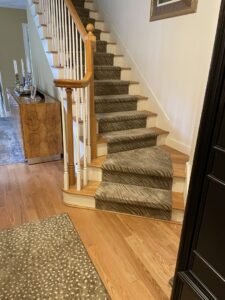 Professional carpet installation on a residential staircase by FCO Carpet Remnant STORE in Pawtucket, RI.