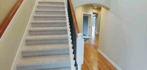 A newly carpeted staircase, showcasing quality carpet installation by H&G Remodel in Burien, WA.