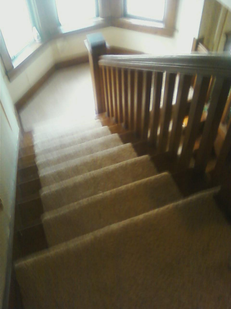 A newly carpeted staircase showing professional installation by Karsten Floors in Kearney, NE.