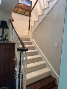 A beautifully carpeted staircase, showcasing professional installation by Peek's Floor Co. in Dallas, TX.