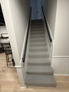A newly installed carpeted staircase by River City Flooring Inc., a carpet contractor in Louisville, KY