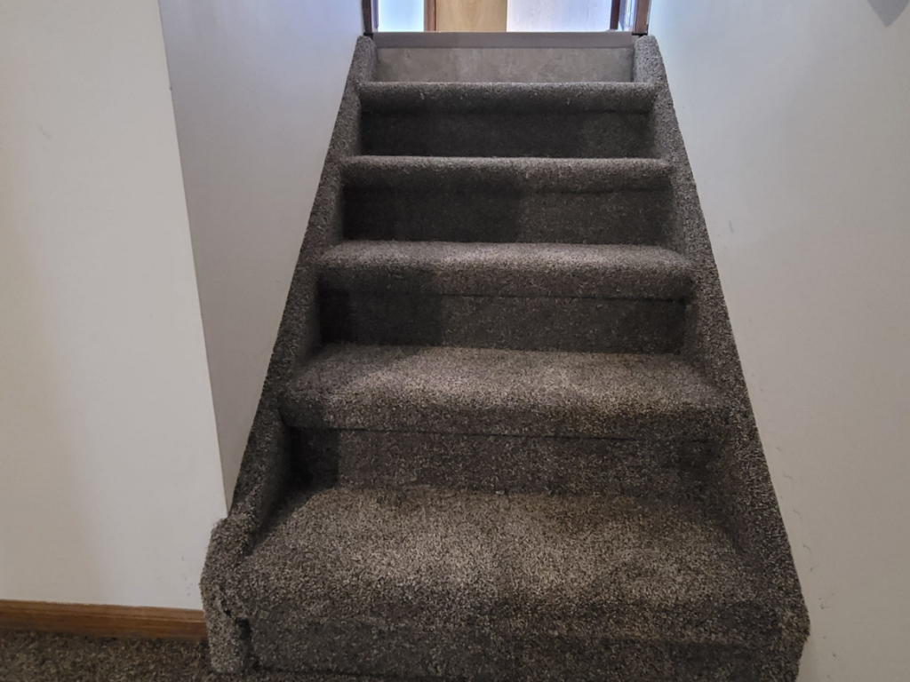 A newly carpeted staircase showing professional installation by Washington Family Flooring LLC in Bellevue, NE.