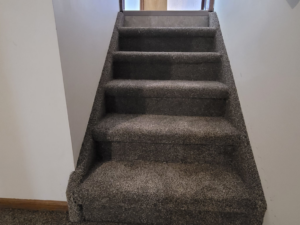 A newly carpeted staircase showing professional installation by Washington Family Flooring LLC in Bellevue, NE.