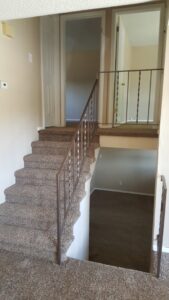 A multi-level home featuring a newly carpeted staircase and landing by Carpet Connection of Denver in Aurora, CO.