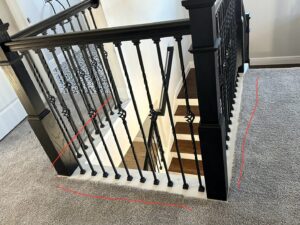 A carpeted staircase with red lines indicating areas for repair or stretching, a service offered by Mr. Carpet Cleaning Orlando, FL.