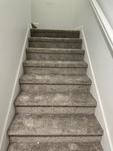 View looking up a carpeted staircase, installed by Millennium Flooring .Co in Salt Lake City, UT.
