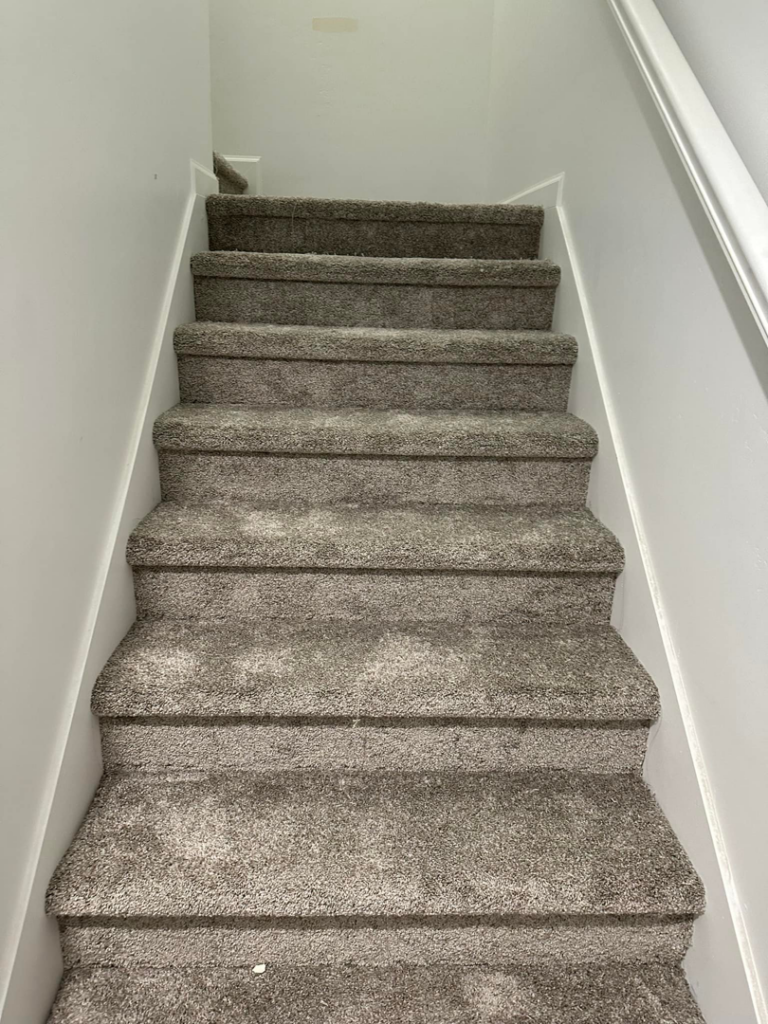 View looking up a carpeted staircase, installed by Millennium Flooring .Co in Salt Lake City, UT.