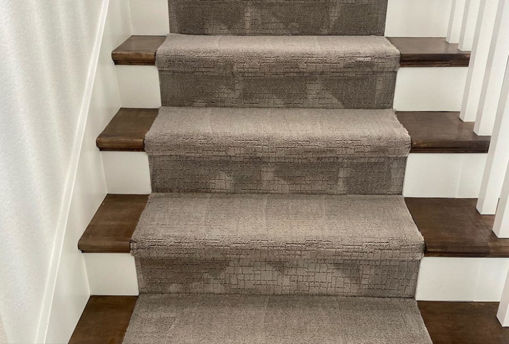 Professionally cleaned carpet on a staircase, demonstrating quality work by A Brighter Cleaning Service in Arlington, TX.