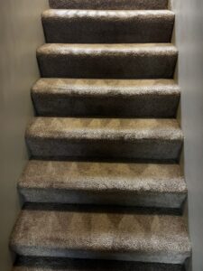 Carpeted stairs showing visible cleaning lines after service by Advanced Floor Cleaning, Inc. in Elgin, IL