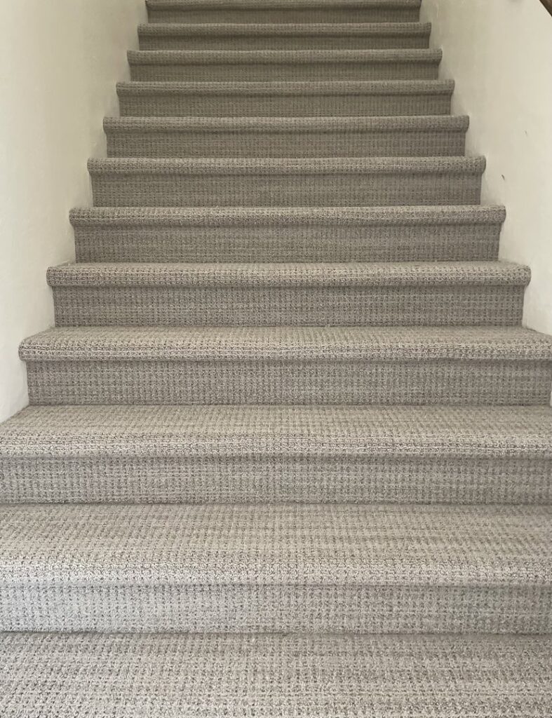 Professionally installed carpet on a staircase by Bentley Carpet Installation & Sales in Phoenix, AZ.
