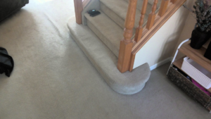 Newly installed light beige carpet on stairs and a landing by Fairbanks Carpets Plus in Fairbanks, AK