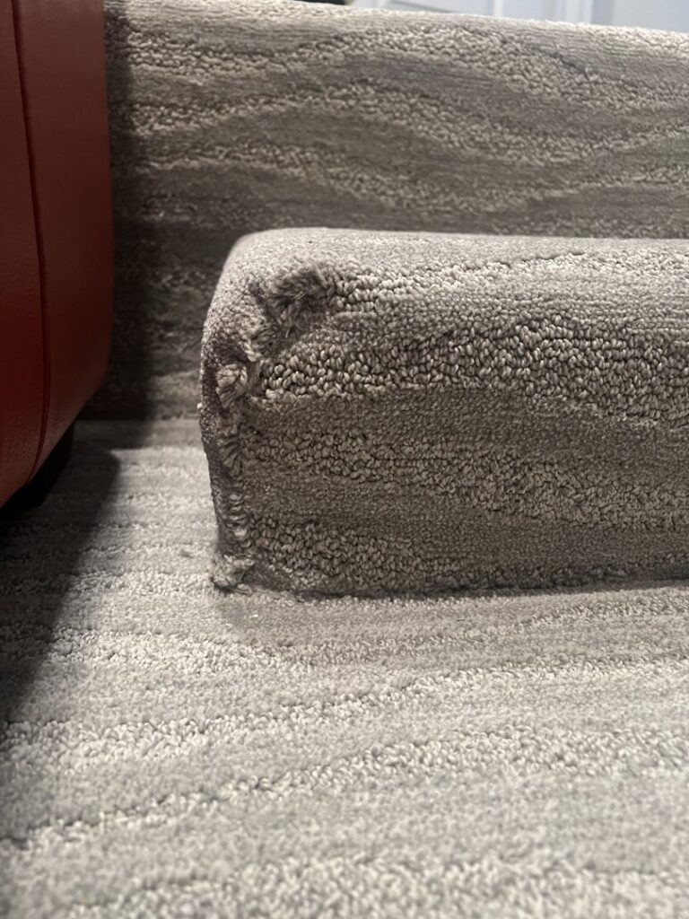 Newly installed gray carpet on stairs by Floors 2 Luv, a professional carpet contractor in Houston, TX