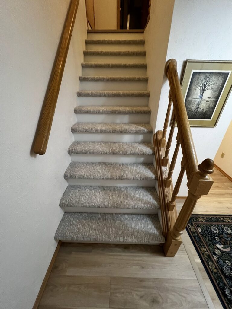Newly installed carpet on stairs by the expert team at Floors By Roberts in Appleton, WI.