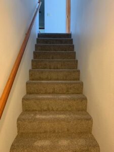 Newly installed brown carpet on a staircase, a completed project by Front Range Interiors in Greeley, CO.