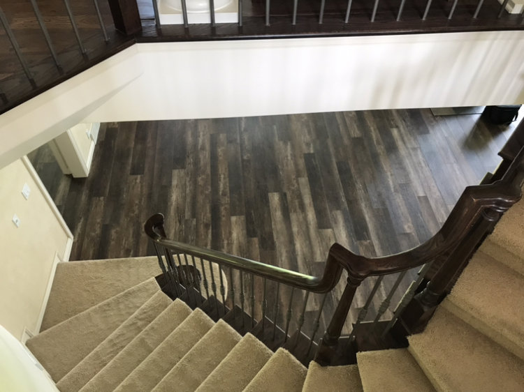 Newly installed carpet on a staircase by Hardwood Refinishing in Omaha, NE
