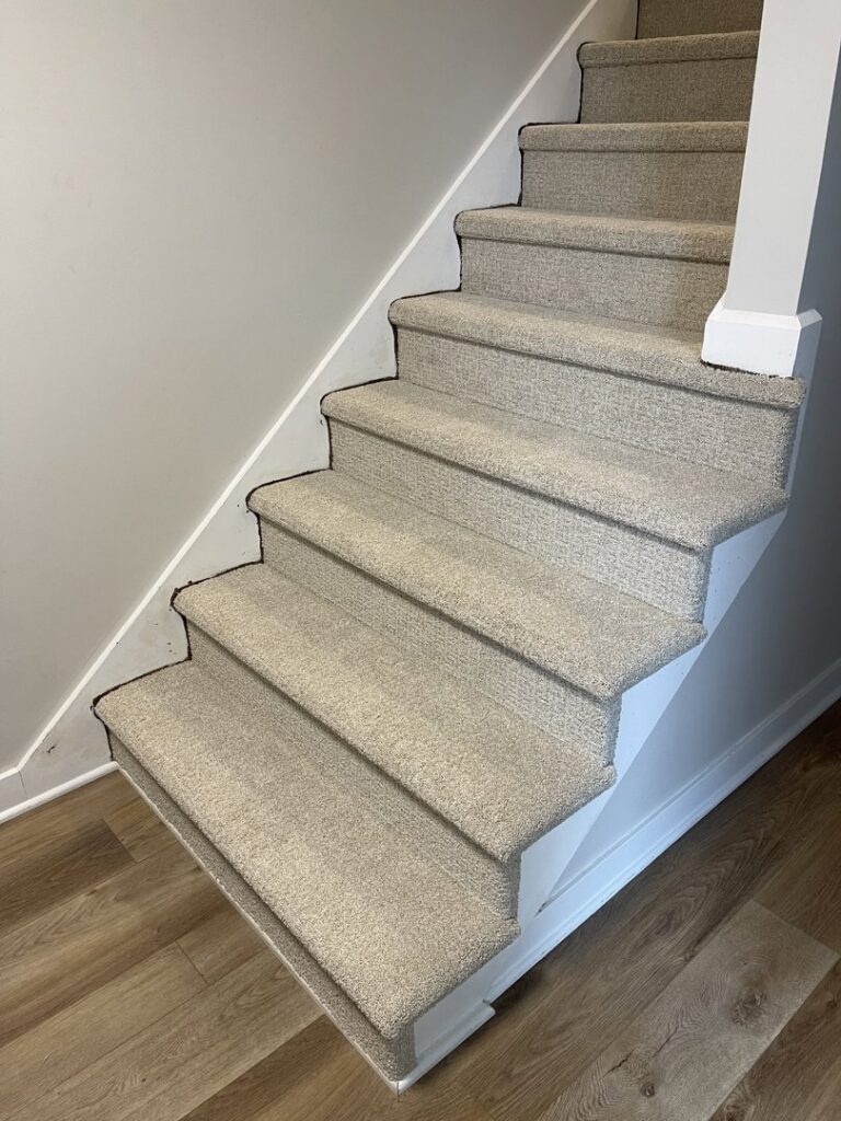 Newly installed carpet on stairs by Mendez Carpet in Grand Rapids, MI.