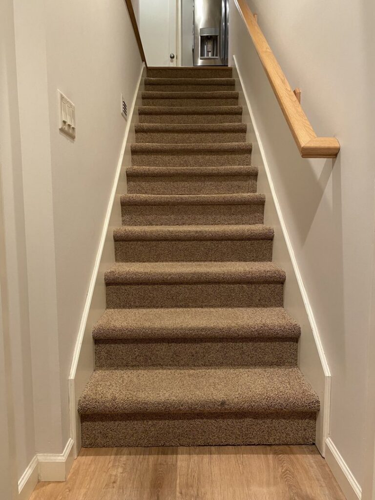 Newly installed brown carpet on stairs by Wood Tiger Floors in Portland, OR