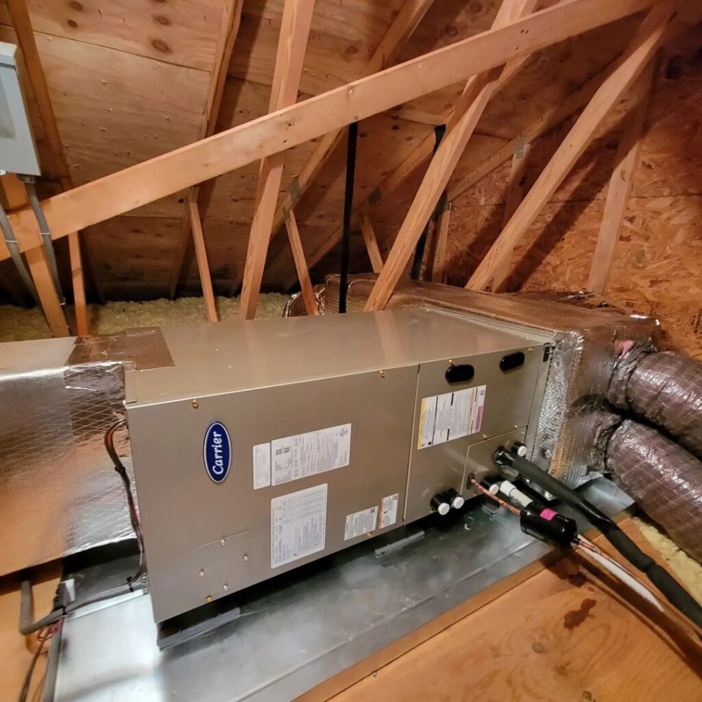 A Carrier air handler unit installed in an attic space by Complete Mechanical Solutions in Novi, MI.