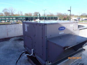 A Carrier brand commercial rooftop HVAC unit, installed or maintained by A-OK Heating & Cooling in Concord, GA.