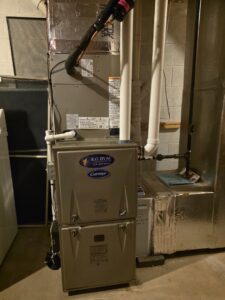 A Carrier furnace and air handler system with ductwork installed by KO HVAC Heating & Cooling in Kingston, PA.
