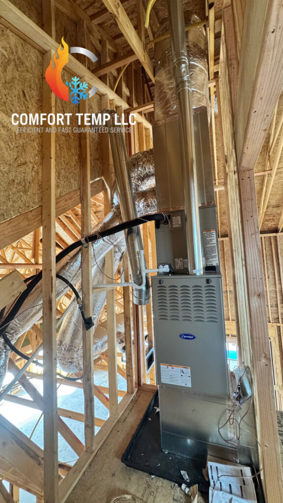 A Carrier furnace and air handler unit installed in a new construction home by Comfort Temp HVAC LLC in Fort Smith, AR
