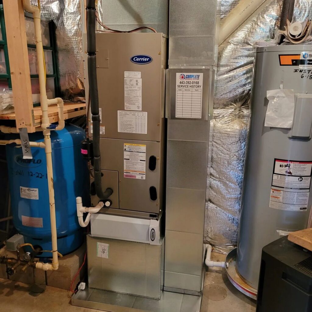 A Carrier furnace and water heater installation by Complete Mechanical Solutions in Novi, MI.
