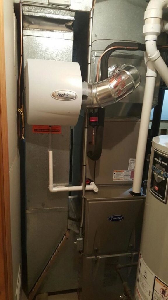 A Carrier furnace with an Aprilaire humidifier installed by Polar Aire Heating & Cooling in Olathe, KS