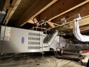 A Carrier HVAC furnace and ductwork installed in a home by Woodfin-Your Home Team in Richmond, VA.