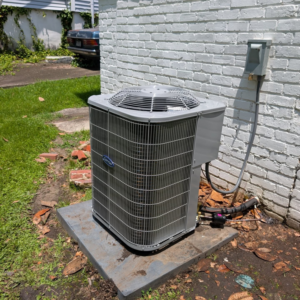 A Carrier brand outdoor air conditioning condenser unit installed by Speedy Nelson HVAC Repair in Durham, NC.