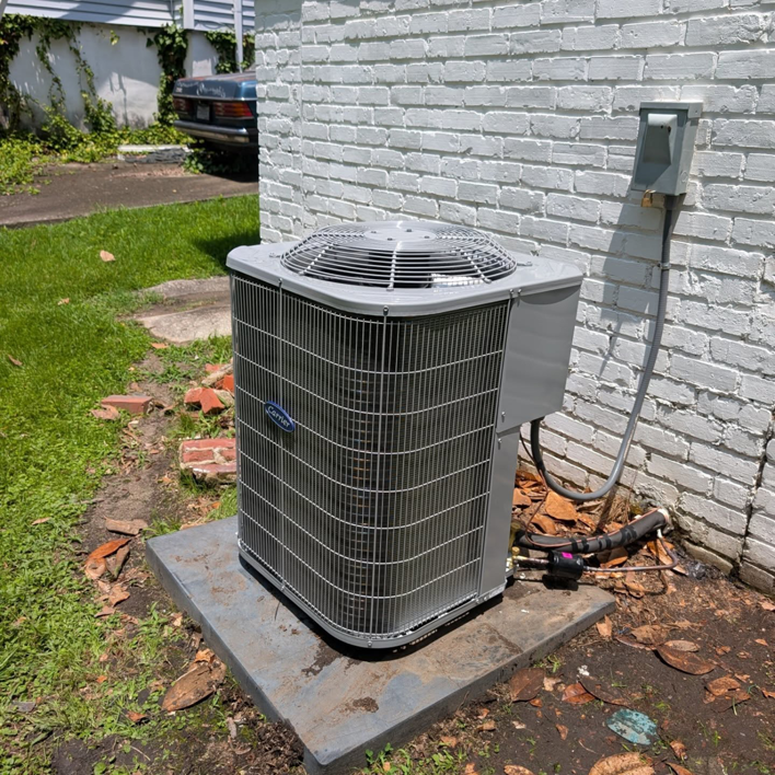 A Carrier brand outdoor air conditioning condenser unit installed by Speedy Nelson HVAC Repair in Durham, NC.