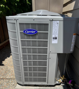 A Carrier brand outdoor air conditioning unit installed next to a house by A and R Air Conditioning & Heating furnace in San Jose, CA.