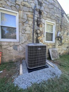 A newly installed Carrier outdoor air conditioning unit by Vanessa Service HVAC in Falls Church, VA.