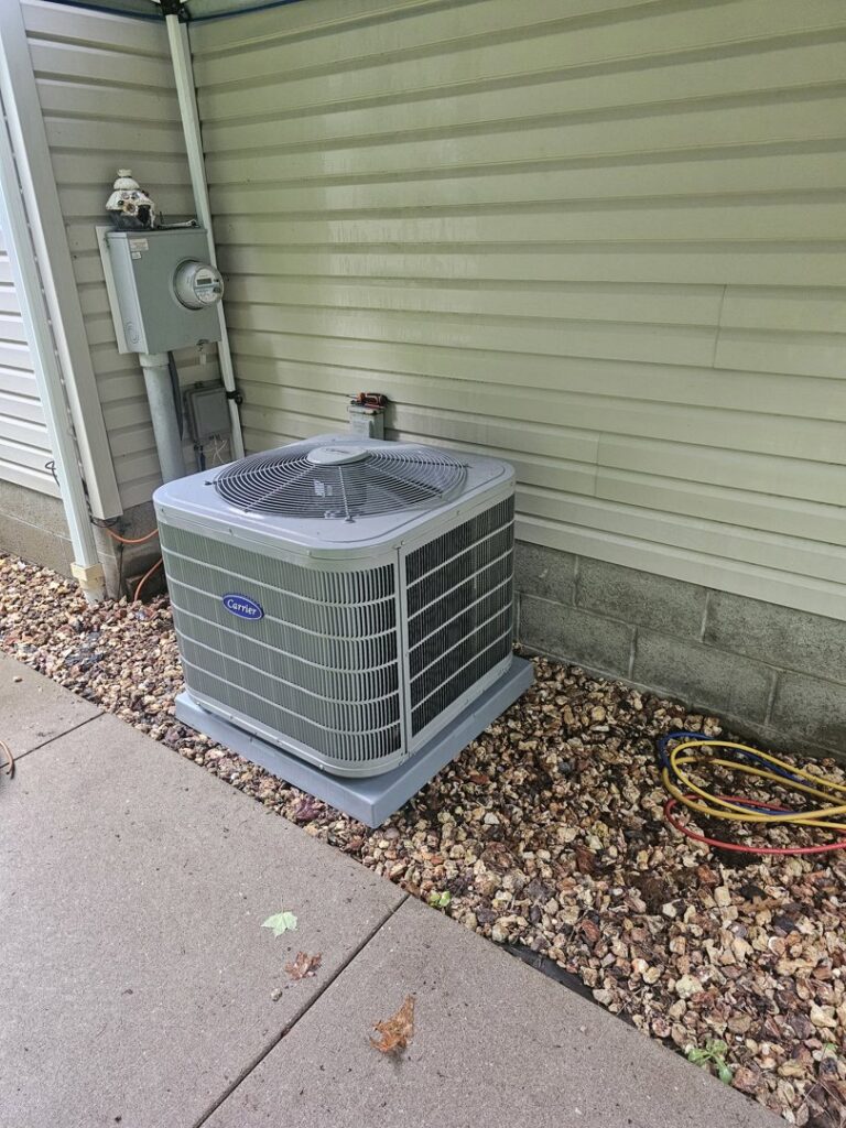 A Carrier outdoor air conditioning unit installed or serviced by T. D'Albora Heating and Cooling in Erie, PA.