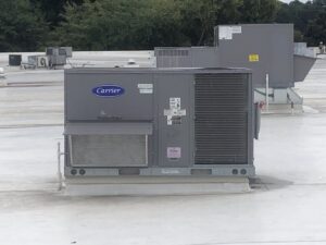 A Carrier WeatherMaker commercial rooftop HVAC unit serviced by Raleigh Comfort Services in Raleigh, NC.