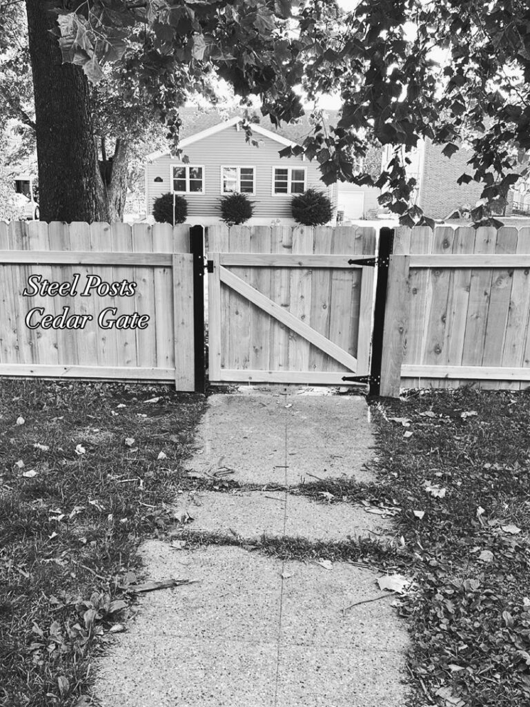 A cedar wood fence featuring steel posts and a matching gate, showcasing quality work by Thrive Fencing in Ames, IA.