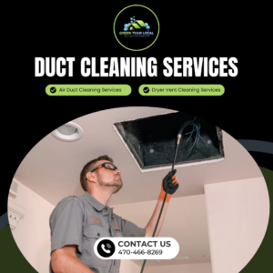 A Green Team Local technician cleaning a ceiling air duct opening with a specialized tool in Page.
