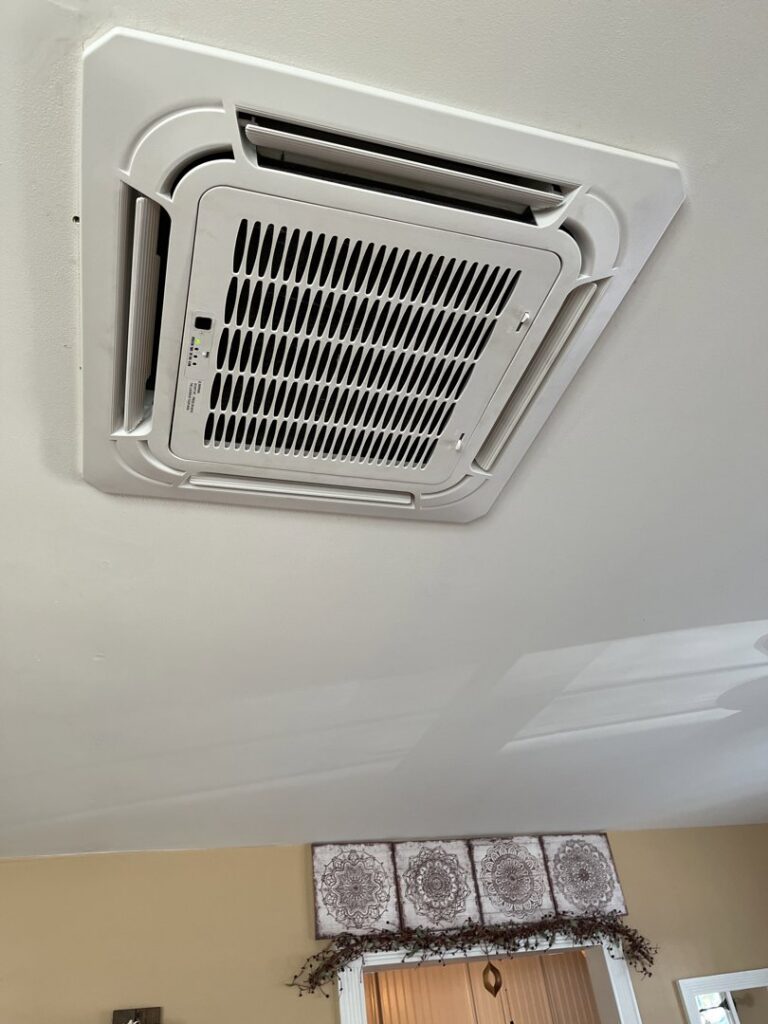 A ceiling-mounted cassette AC unit installed by BC Express Inc Heating & Air Conditioning in Toms River, NJ.