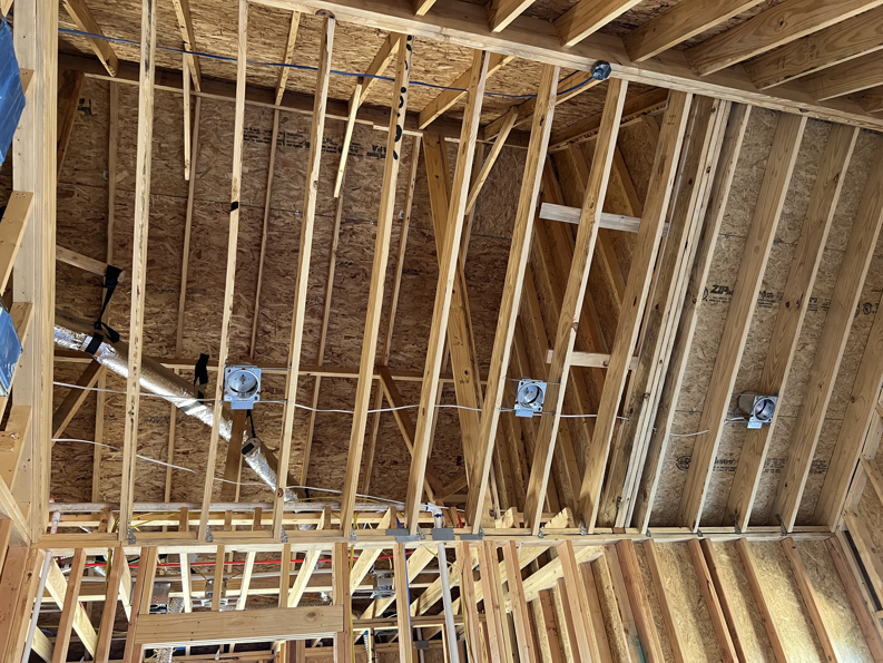 Ceiling electrical boxes and wiring for light fixtures in a new build by TJAM Electric in Springtown, TX.