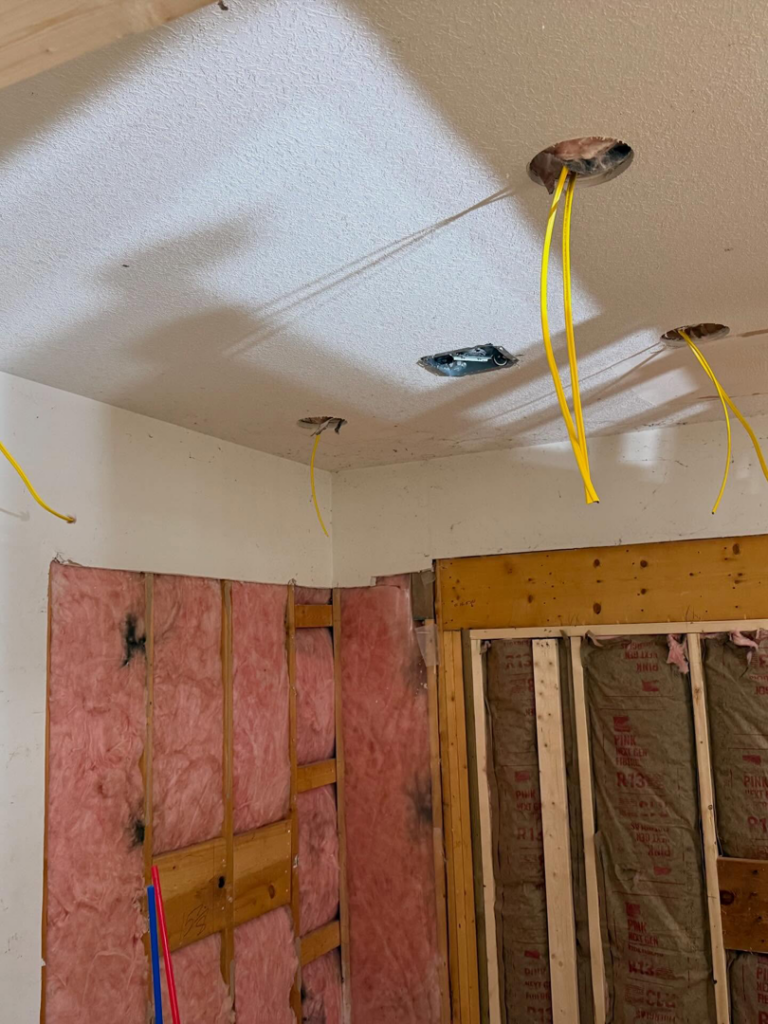 Ceiling electrical wiring rough-in with yellow cables for light fixtures by J's Electrical & Maintenance Services, LLC in Columbus, OH.